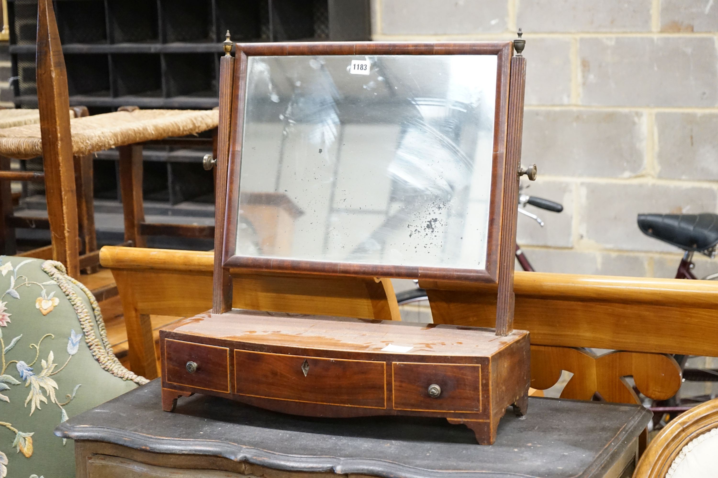 A George IV inlaid mahogany bow fronted box base toilet mirror, width 57cm, depth 22cm, height 62cm